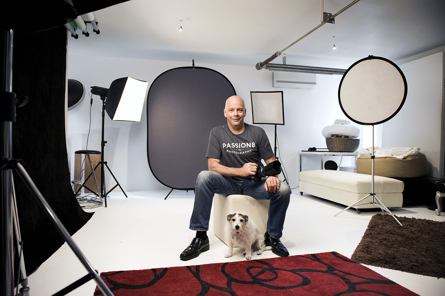 Photographer Andrew Harrison in his home studio with his scruffy assistant