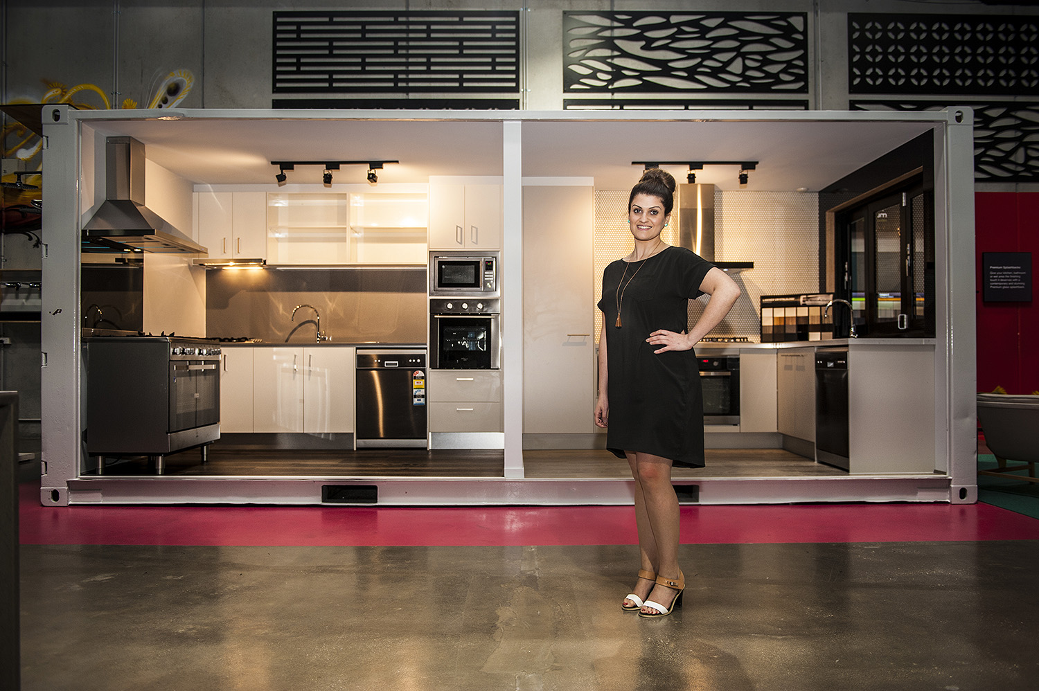 Interior designer and decorator Liana Corbino at her workplace with some merchendize displays