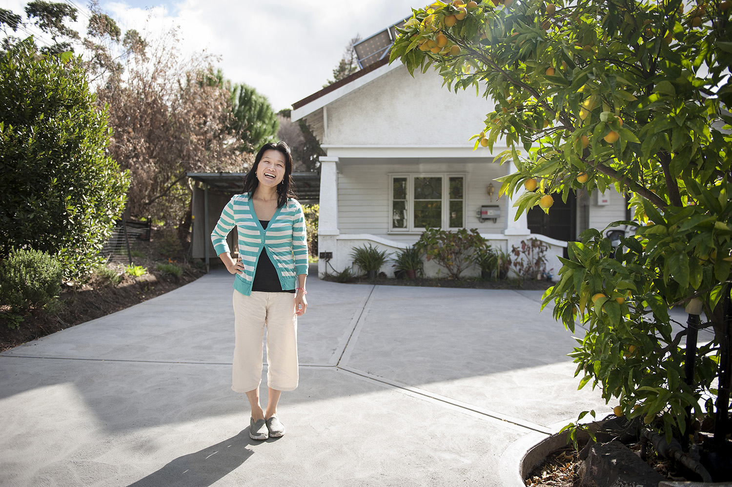 Property Investor tina koh in front of her home